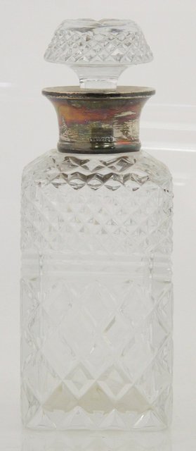 A cut glass decanter and stopper