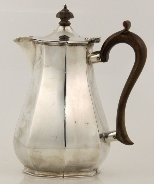 An octagonal silver coffee pot