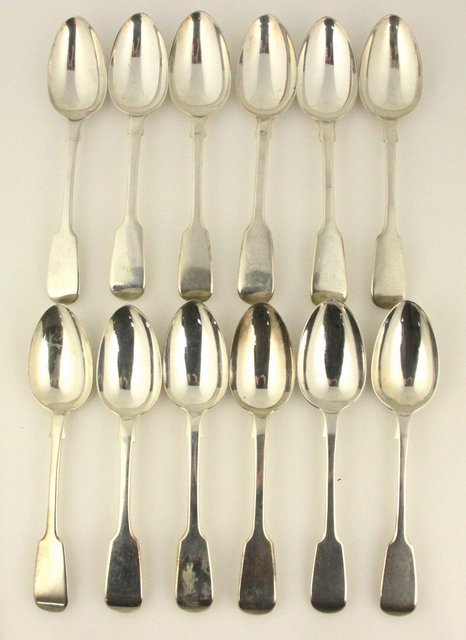 A set of twelve silver dessert spoons