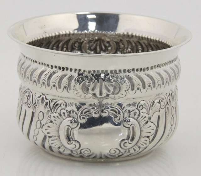 An embossed silver circular bowl