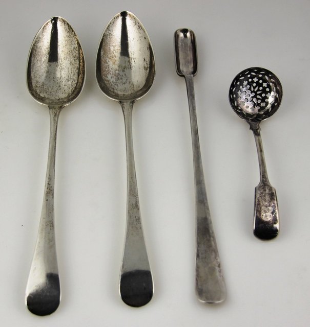 A near pair of silver serving spoons 1648ff