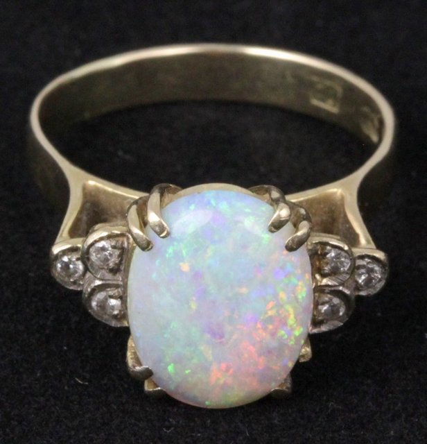 An opal dress ring the oval stone 16492e