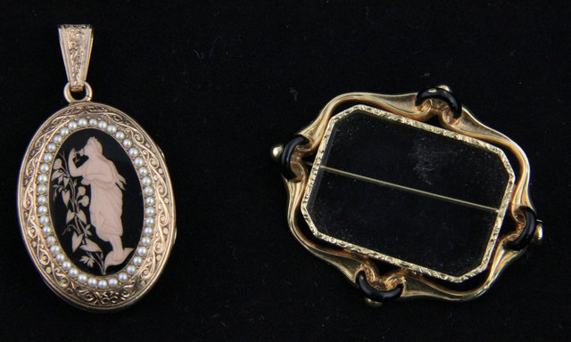 An oval locket centred by an enamel