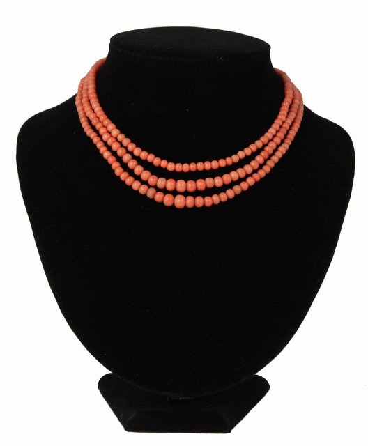 A three strand coral bead necklace 164937