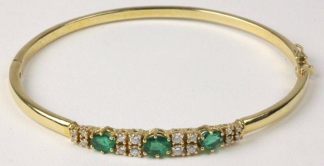 An emerald and diamond set 18ct