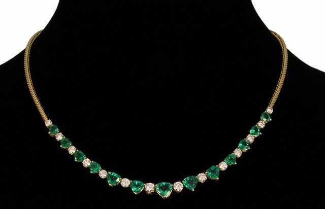 An emerald and diamond set 18ct