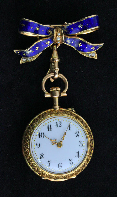 A ladys 18ct gold and blue enamel watch