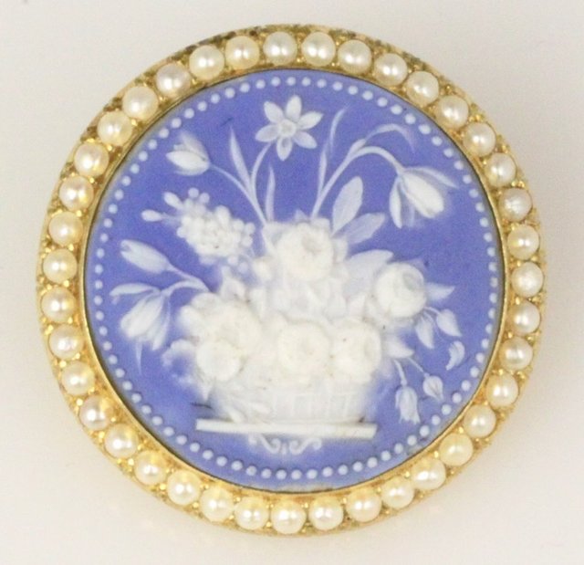 A jasperware brooch the circular