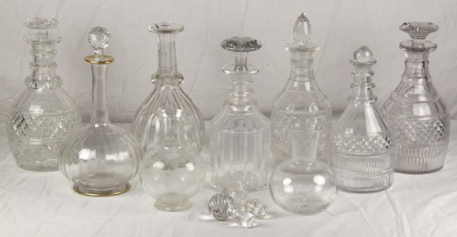 A collection of cut decanters some