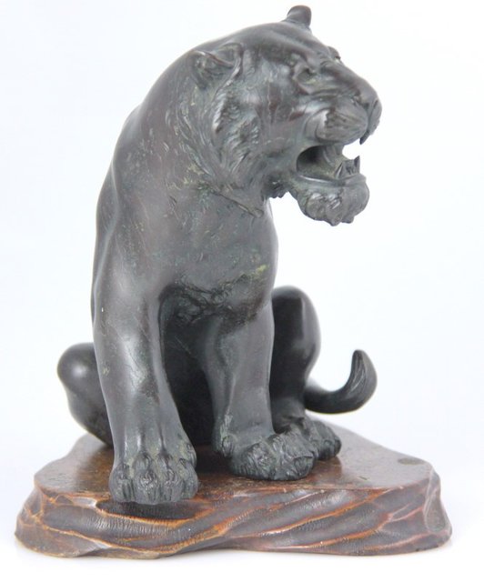 A Japanese bronze of a sitting tiger