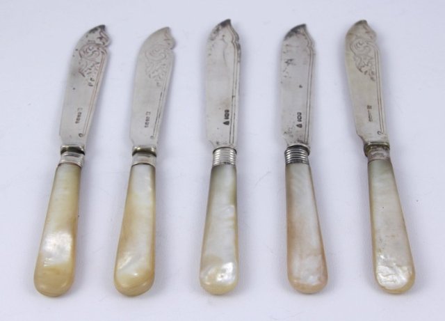 Five engraved silver fish knives