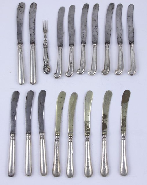 Seven silver tea knives with filled 16555a