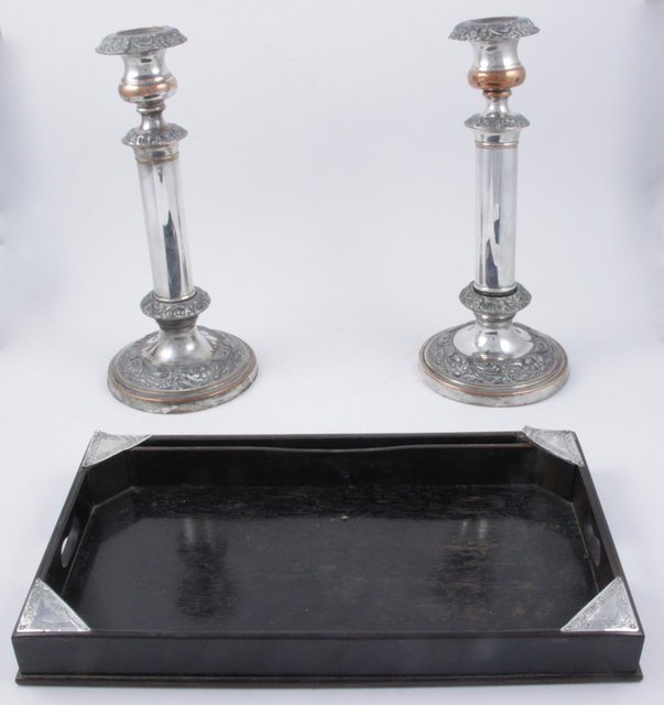 A small tray with silver set corners