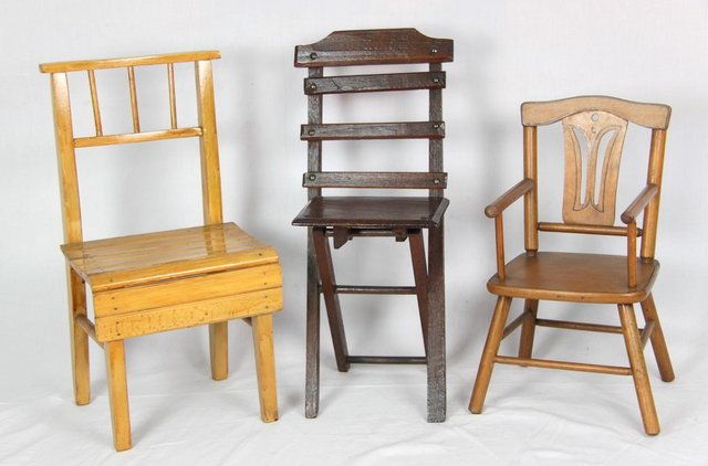 A collection of three dolls chairs