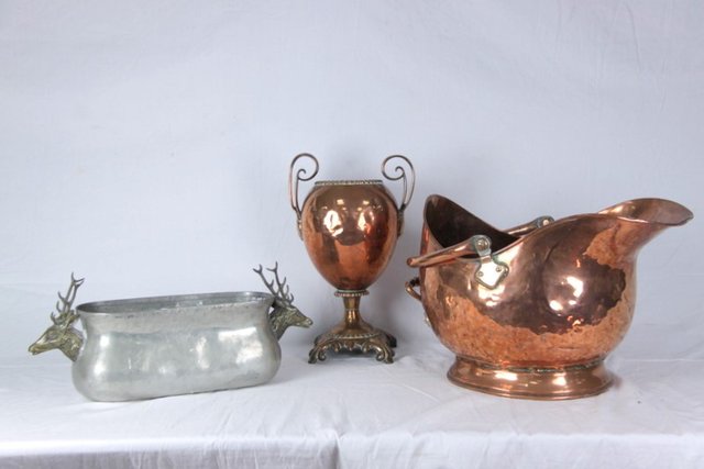 A copper two-handled urn circa