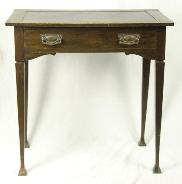 An Art Nouveau oak side table with 16560c
