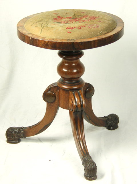 A rosewood piano stool with needlework