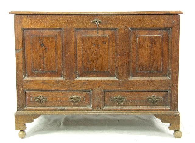 An oak mule chest with panelled
