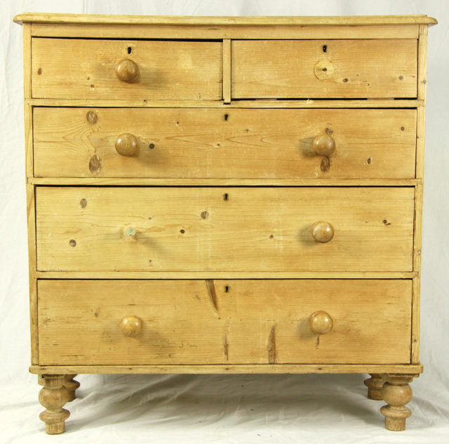 A pine chest of three long and two short