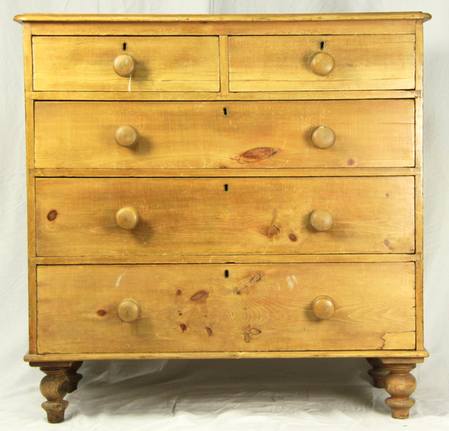 A pine chest of three long and two short