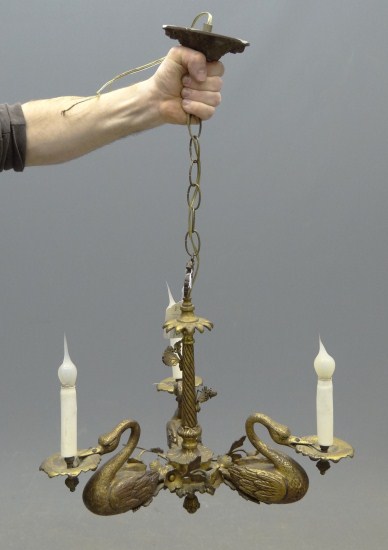 Brass hanging swan form chandelier.