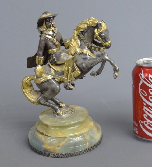 Mixed metals sculpture man on horseback.