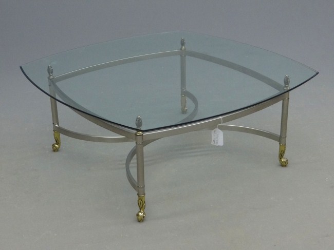 Modern coffee table with glass top.