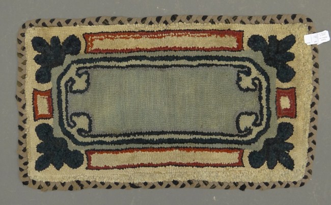 Early geometric hooked rug.