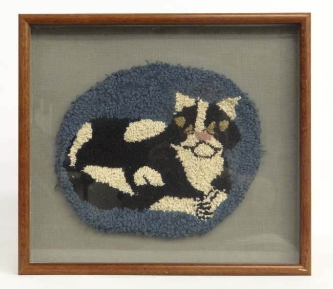 Framed cat hooked rug.
