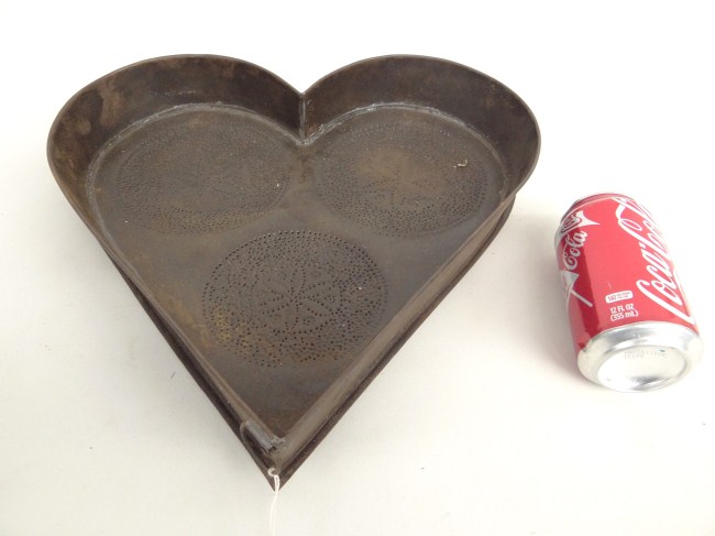 Heart shaped iron cheese drainer.