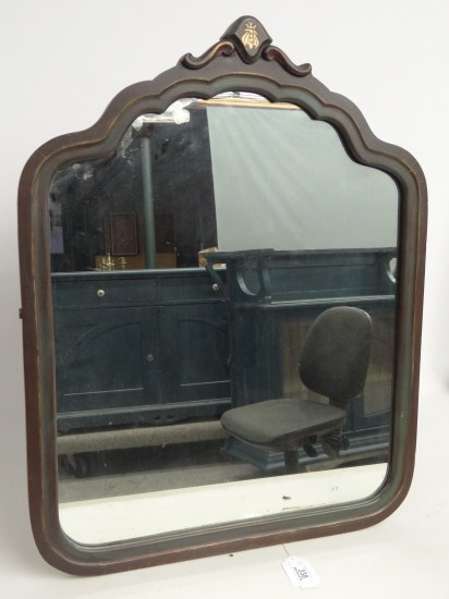 Vintage mirror with painted bug at top.