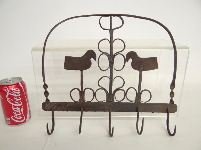 Iron hook rack with bird decoration.
