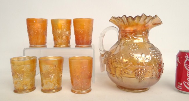 Vintage Carnival glass pitcher and six