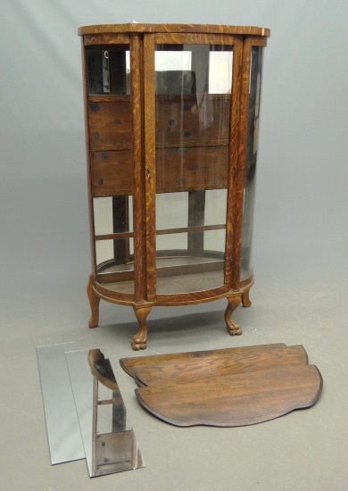 C. 1900 oak curved glass china cabinet.