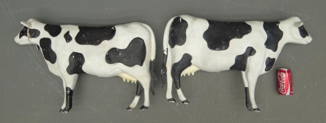 Lot two plastic cow decorations.