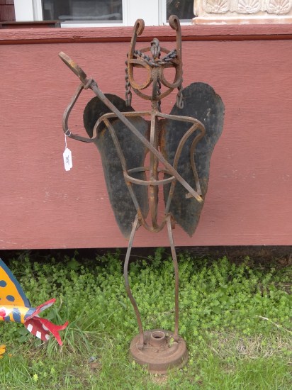 Outdoor sculpture winged figure.