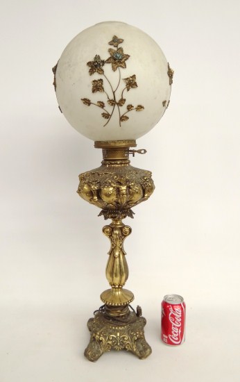 Decorative brass lamp with shade.