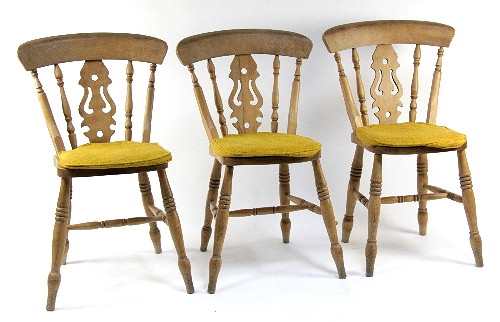 Seven kitchen chairs with pierced upright
