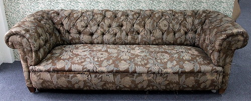 A large Victorian upholstered Chesterfield