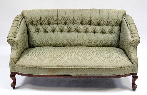 A button upholstered settee on cabriole