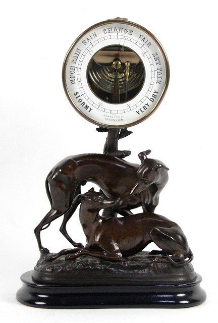 A holosteric barometer with brass bezzle