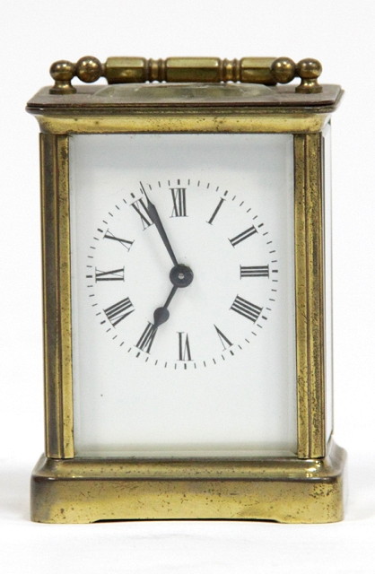 A gilt brass carriage clock fitted