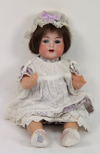 An Armand Marseille bisque headed doll