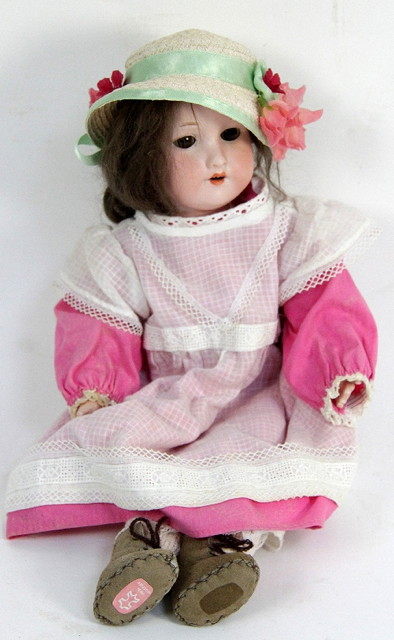 An Armand Marseille bisque headed doll