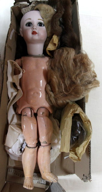 A Bisque headed doll with composite