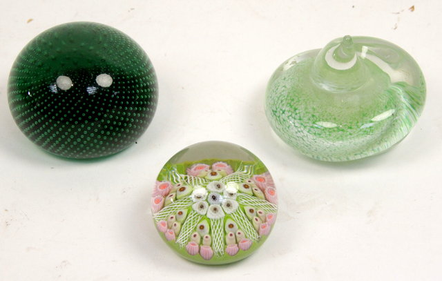 A millefiori paperweight and two others