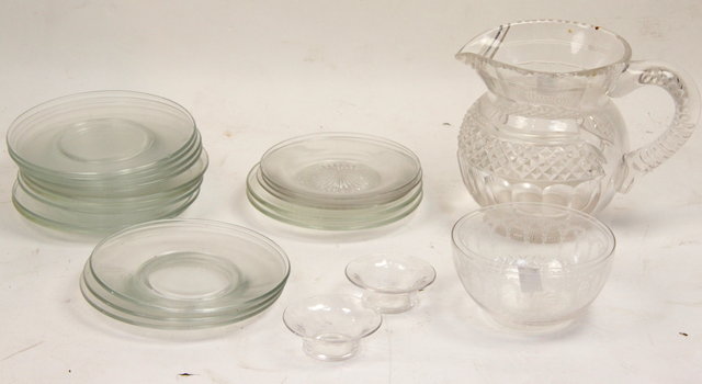A cut glass jug two finger bowls and
