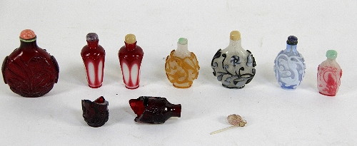 Eight glass snuff bottles cut and overlaid