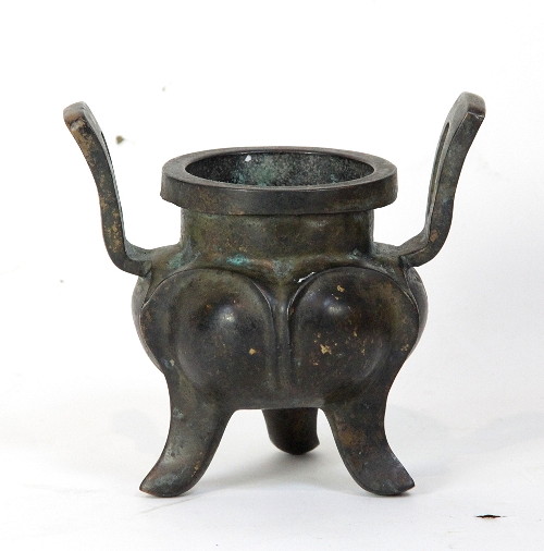 A Chinese bronze censer with two lug