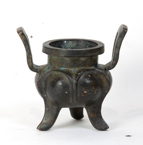 A Chinese bronze censer with two